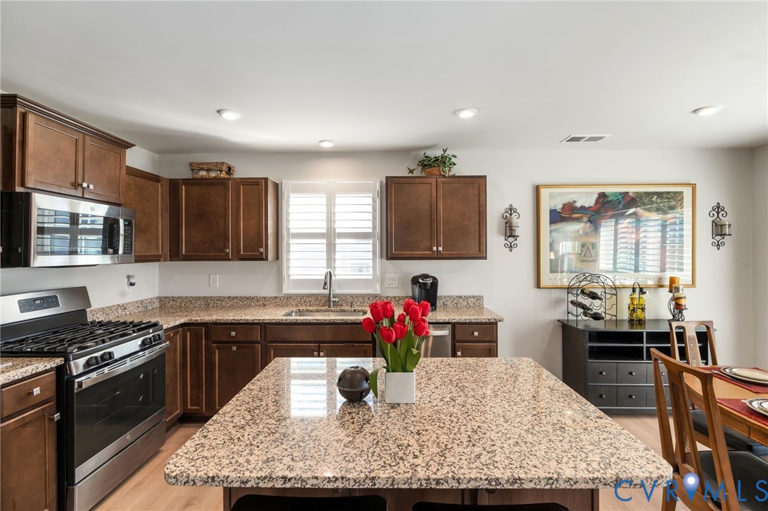 7735 Medalist Lane New Kent, VA 23124 - Photo 10 of 47 Kitchen with stainless steel appliances, dark brow