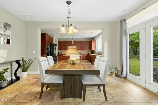 a kitchen with granite countertop stainless steel appliances wooden cabinets and a sink