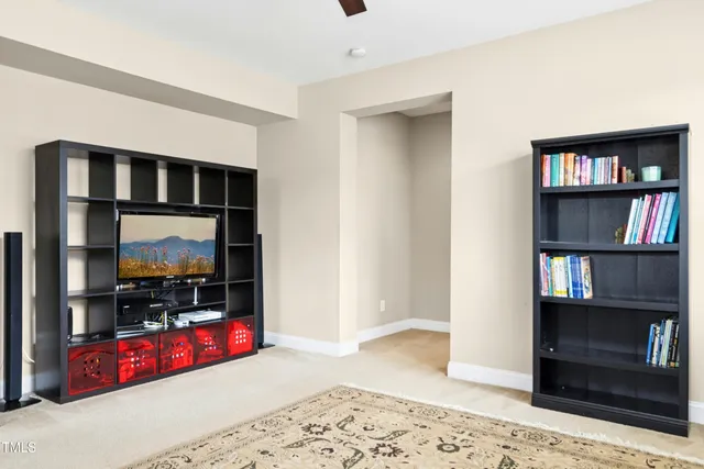a view of a dining room with furniture and a chandelier