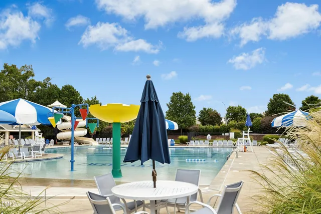 a bathroom with a tub sink shower and mirror