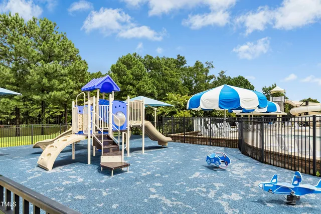 a bathroom with a sink mirror and tub