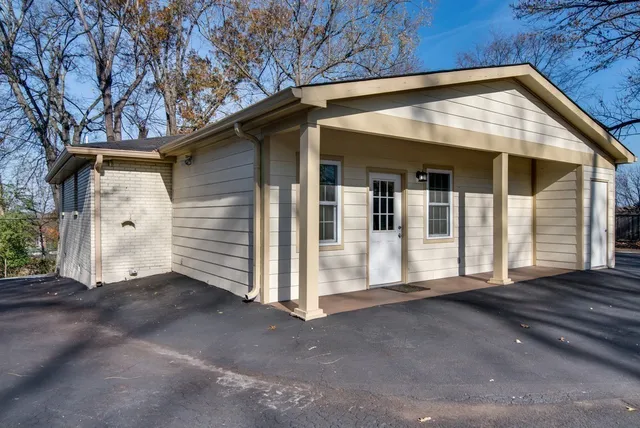 a view of a yard with trees