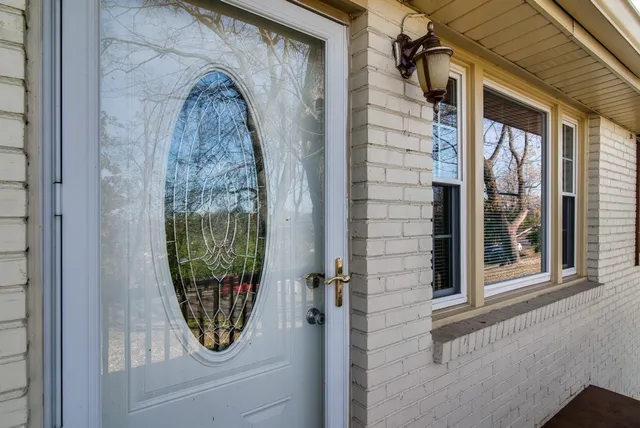 a view of a door and chair in the balcony