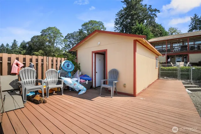 a view of a wooden deck with furniture
