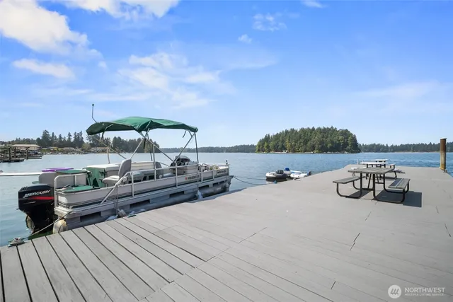 a lake view with tables and chairs