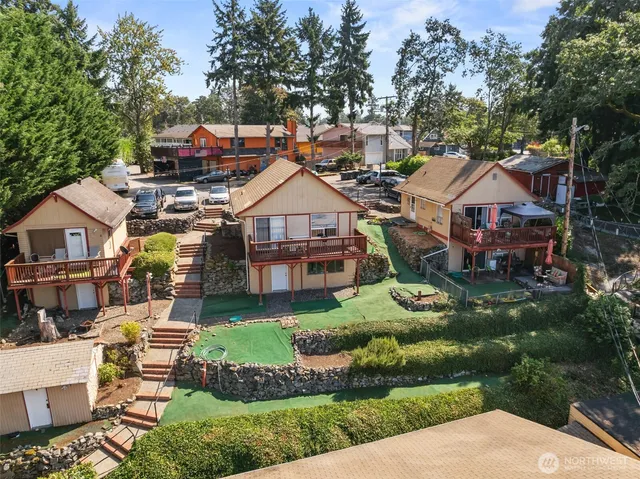 a aerial view of a house with swimming pool and garden