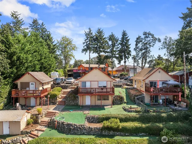 a front view of a house with a garden