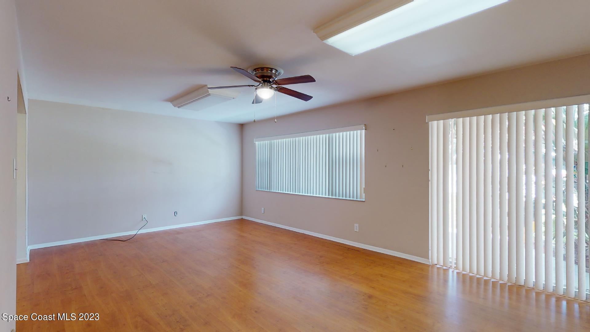 204 South Riverside Drive Indialantic, FL 32903 - Photo 12 of 24 a view of room with window and ceiling fan