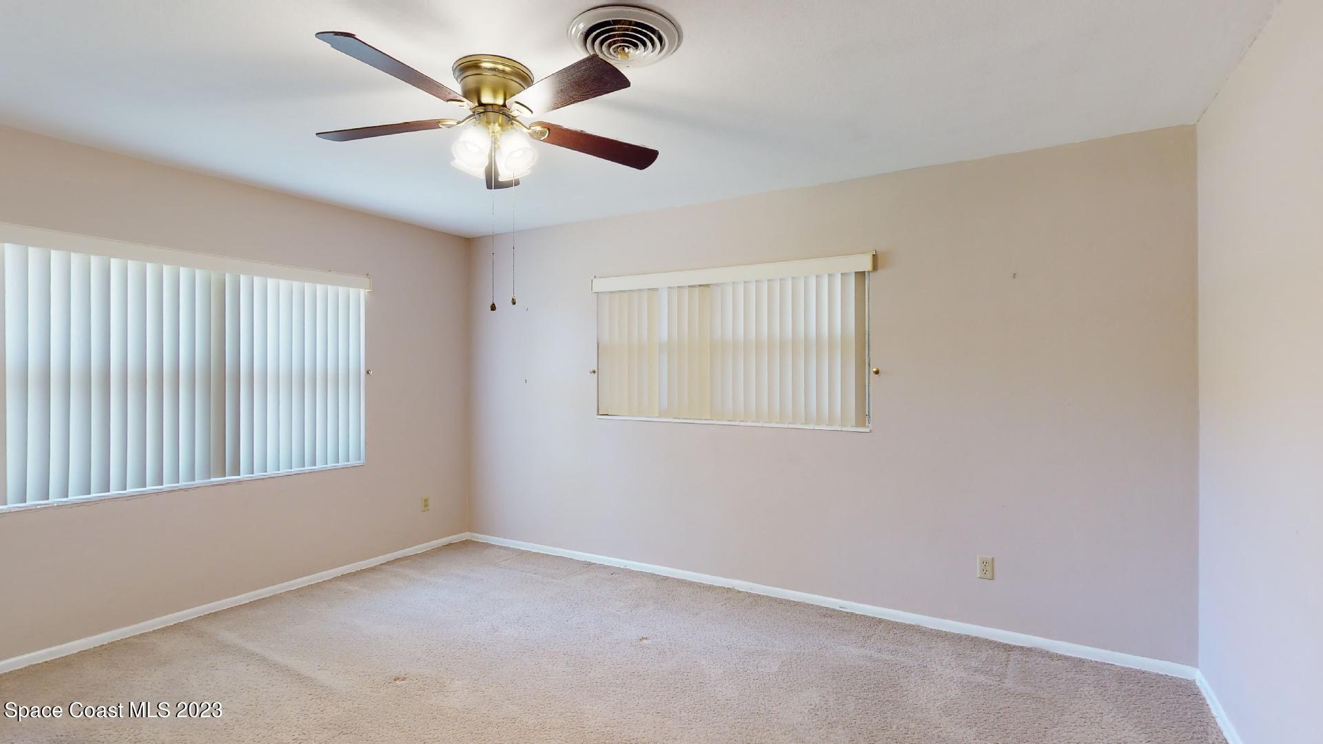204 South Riverside Drive Indialantic, FL 32903 - Photo 17 of 24 a view of an empty room with a window