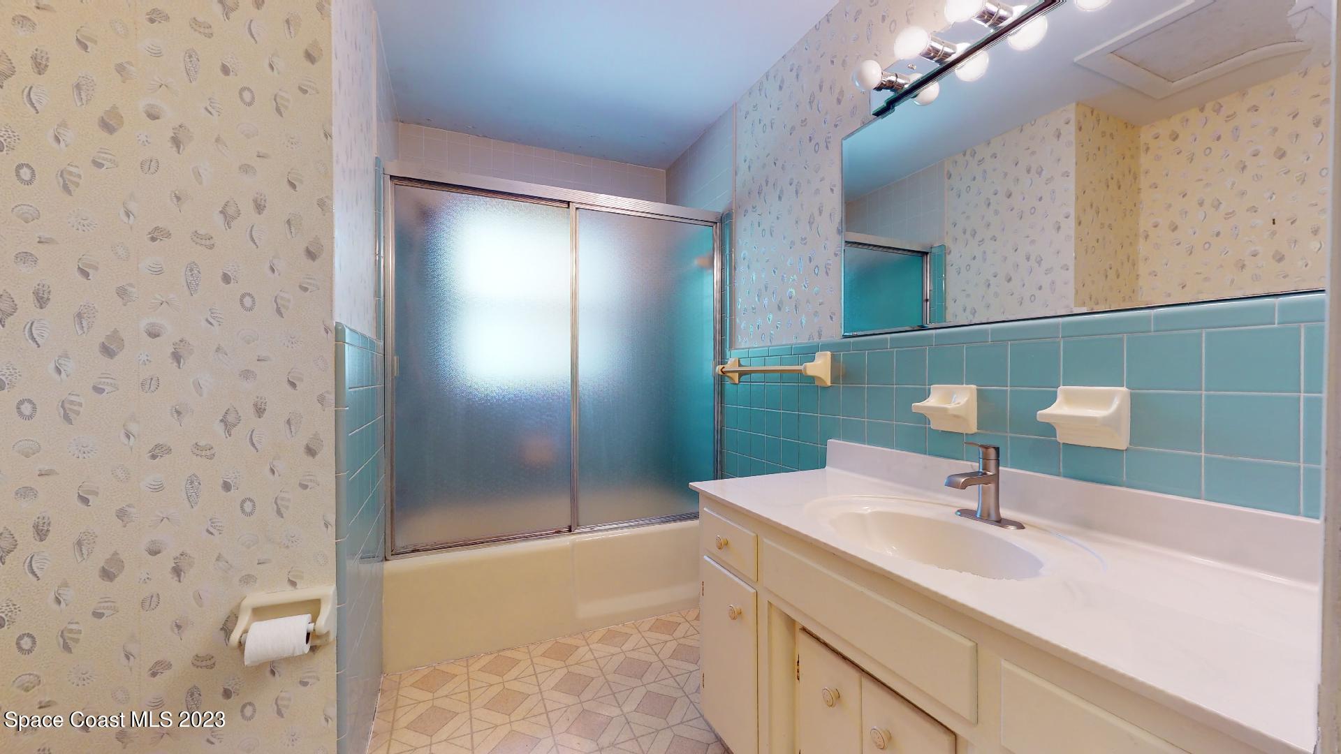 204 South Riverside Drive Indialantic, FL 32903 - Photo 18 of 24 a bathroom with a sink and a mirror