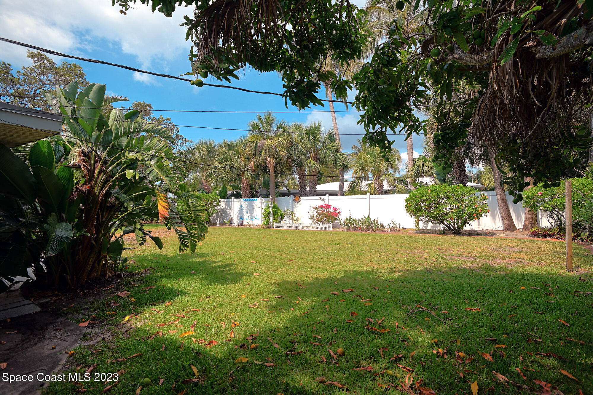 204 South Riverside Drive Indialantic, FL 32903 - Photo 20 of 24 a view of yard with green space and trees around