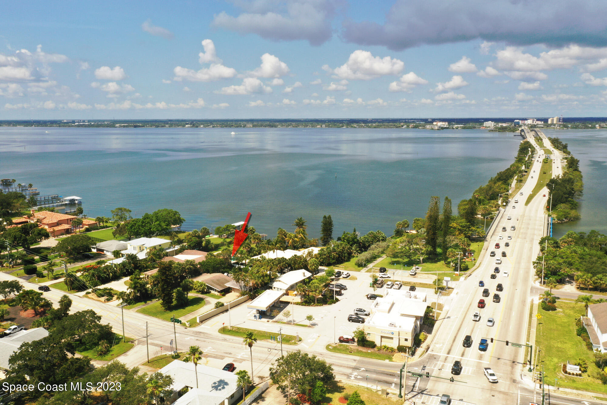 204 South Riverside Drive Indialantic, FL 32903 - Photo 24 of 24 a view of a lake with a building in the background