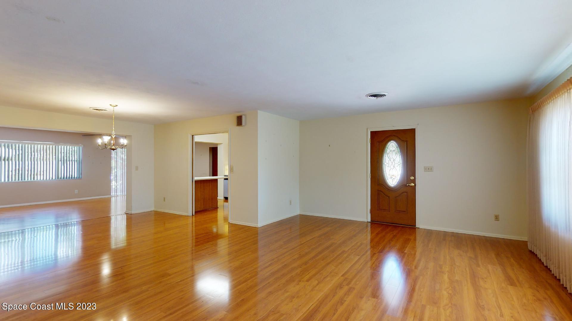 204 South Riverside Drive Indialantic, FL 32903 - Photo 4 of 24 a view of a livingroom with wooden floor