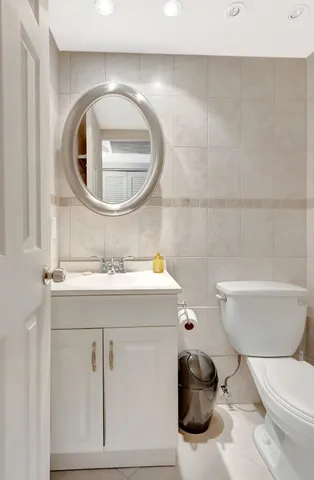 a bedroom with a bed a table and a large window