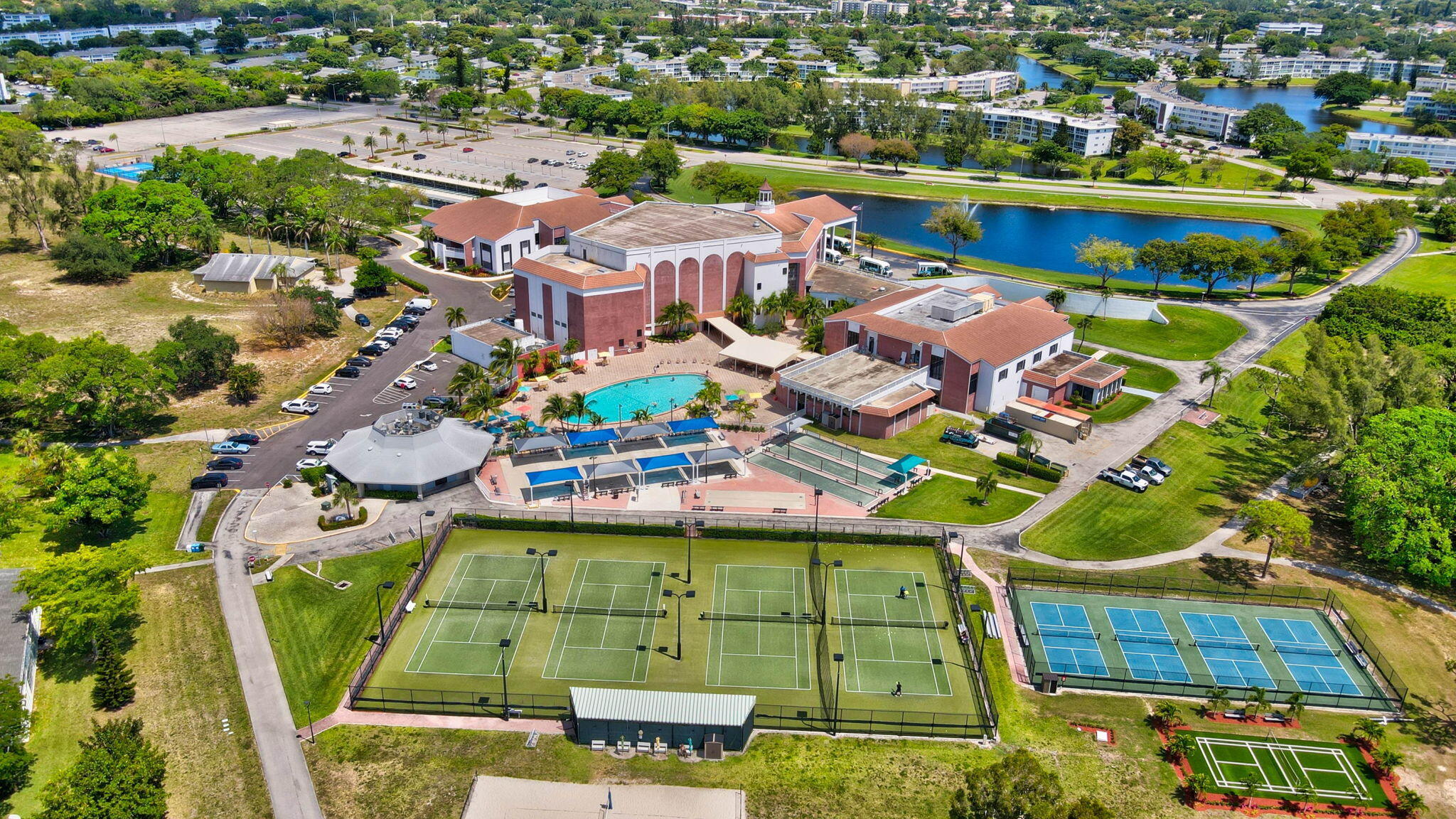 2043 Cambridge C Deerfield Beach, FL 33442 - Photo 65 of 75 an aerial view of residential houses with outdoor space and swimming pool