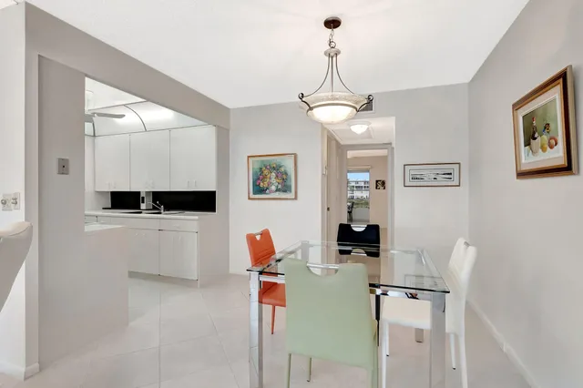 a kitchen with a sink and a washer dryer