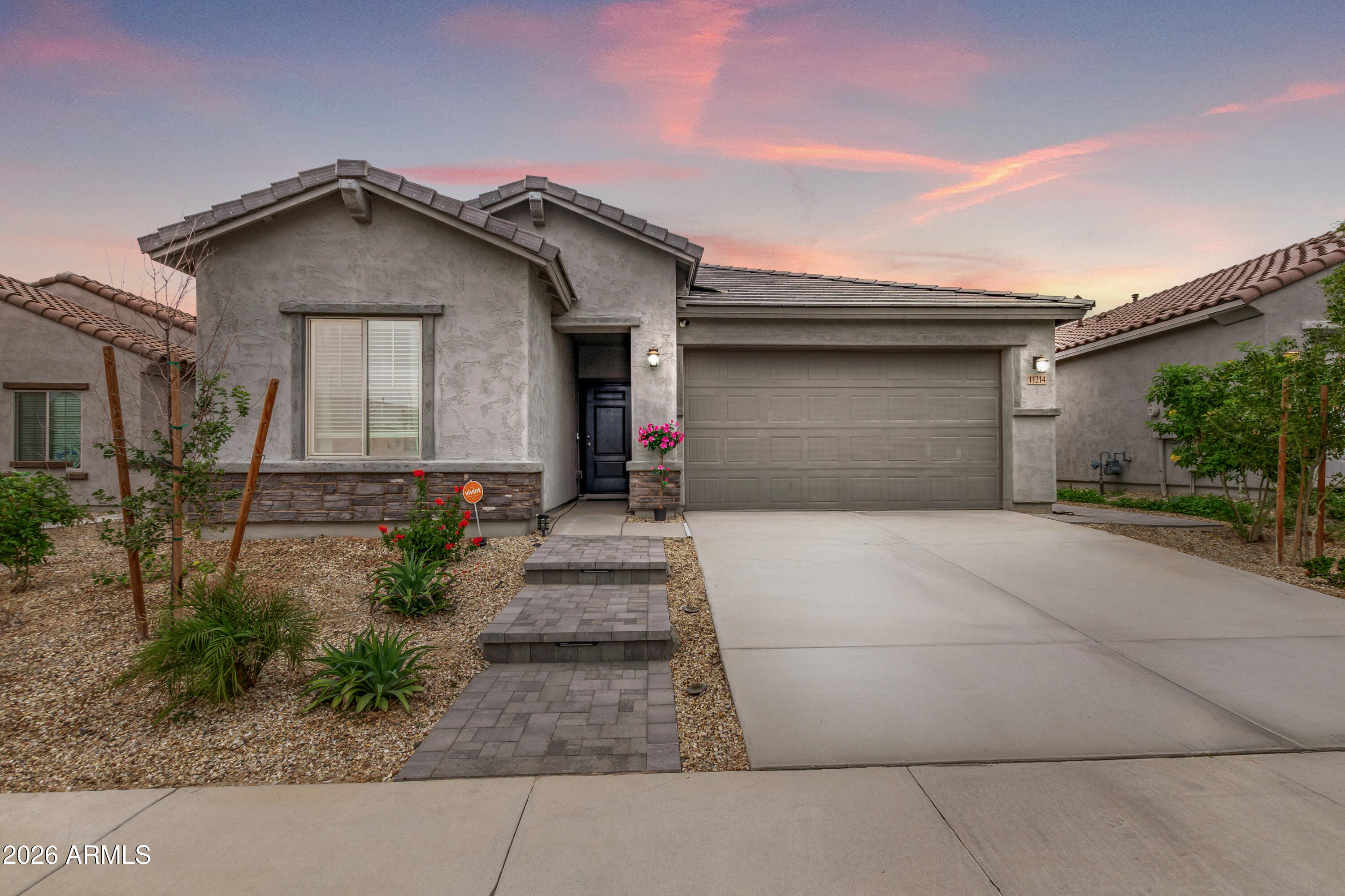 11214 West Bloch Road Tolleson, AZ 85353 - Photo 1 of 24 a front view of a house with garden