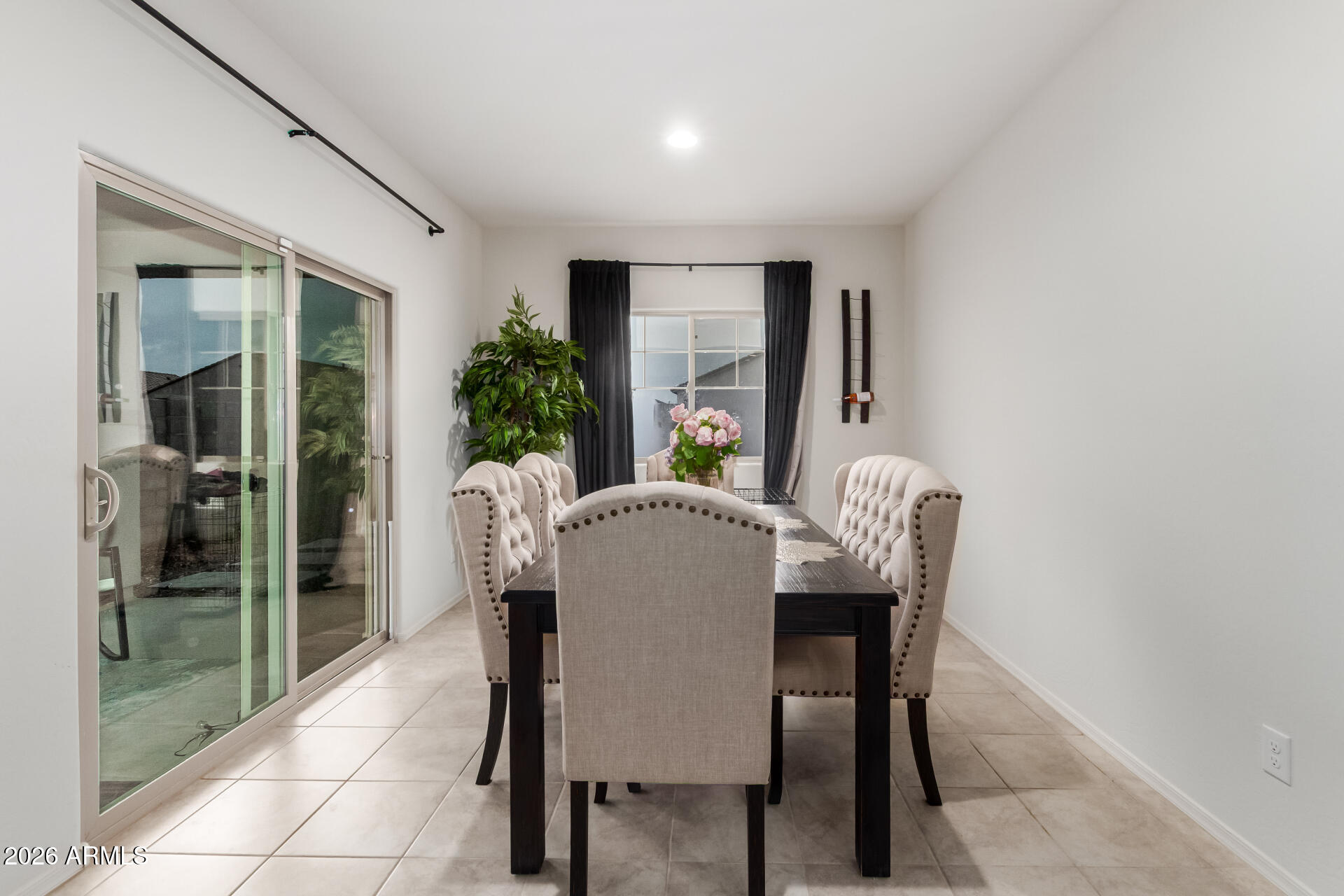 11214 West Bloch Road Tolleson, AZ 85353 - Photo 11 of 24 a dining room with furniture and window