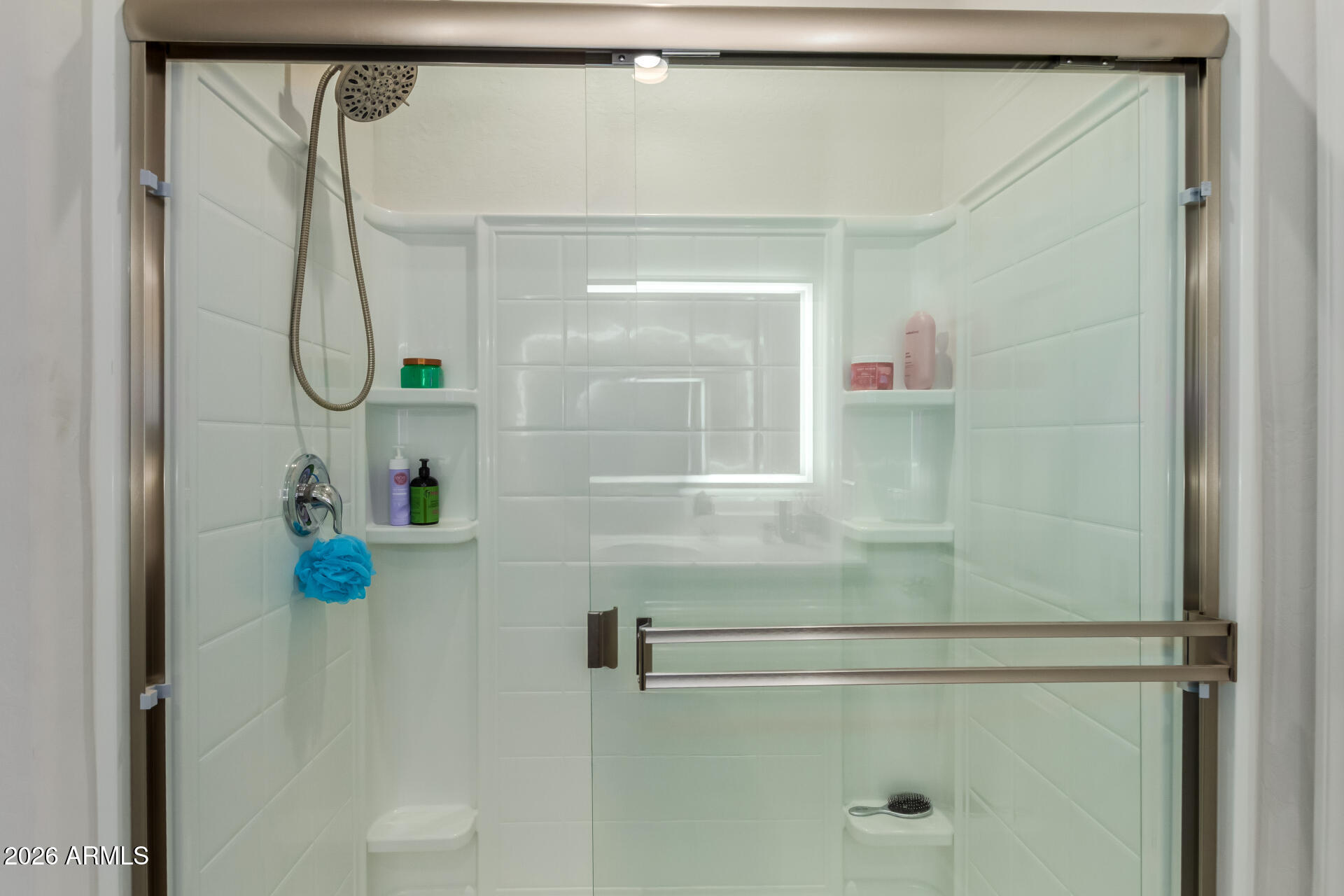 11214 West Bloch Road Tolleson, AZ 85353 - Photo 16 of 24 a bathroom with a shower