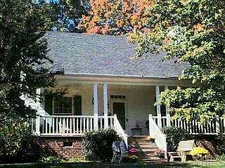 2225 The Circle Raleigh, NC 27608 - Photo 1 of 1 front view of a house with a garden