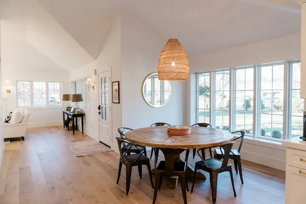 a view of a dining room with furniture window and wooden floor