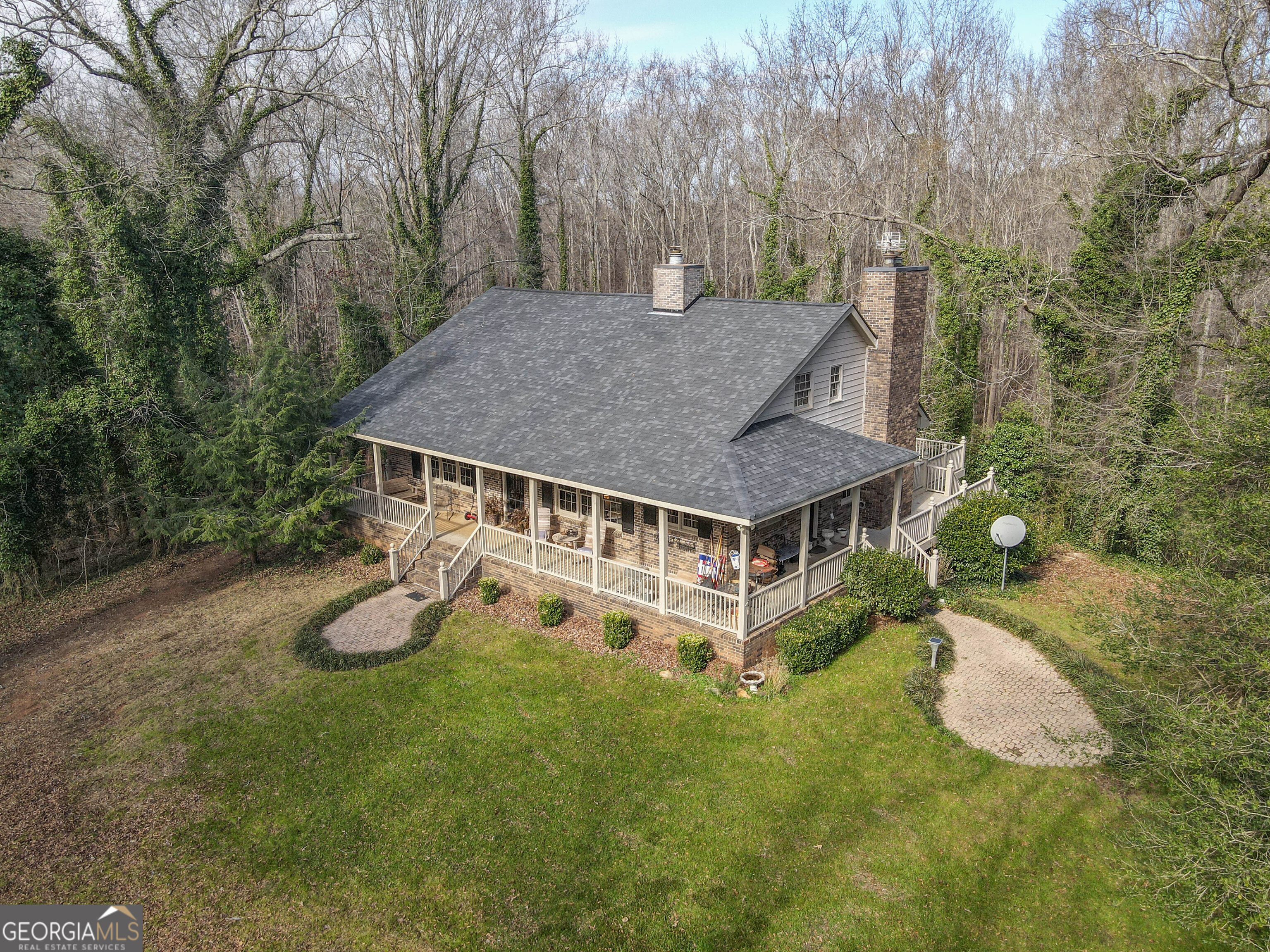 151 Evans Road Milner, GA 30257 - Photo 2 of 53 an aerial view of a house with swimming pool and trees