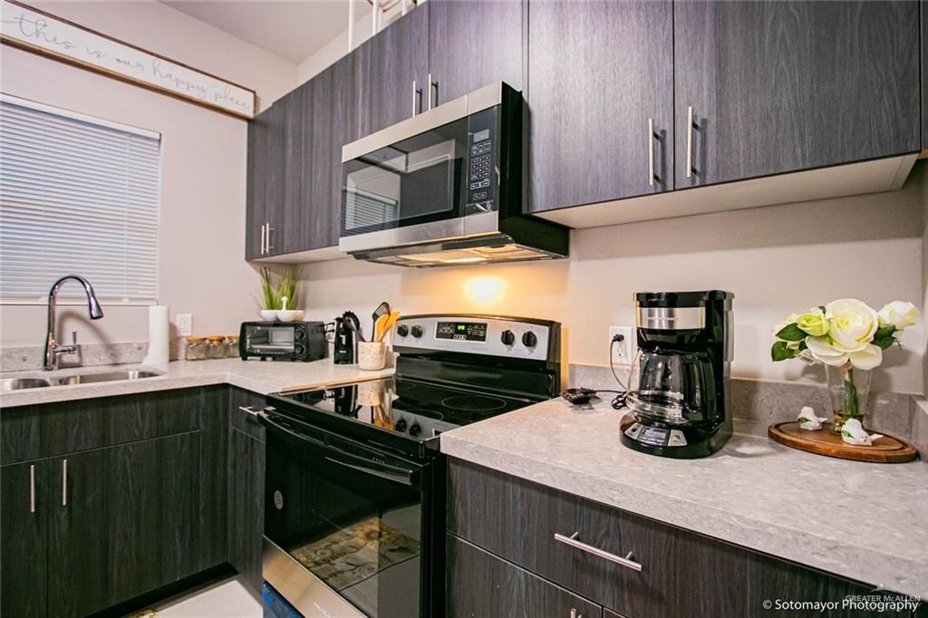 5605 Swallow Avenue, Unit 3 Mission, TX 78573 - Photo 5 of 15 a kitchen with a sink stove and microwave