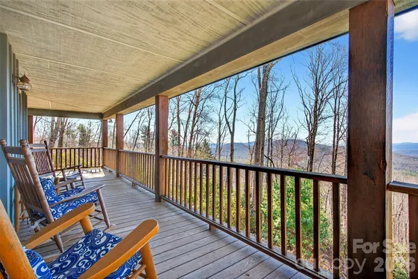 a view of a porch with wooden floor