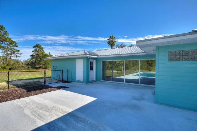 a front view of a house with a garden and yard