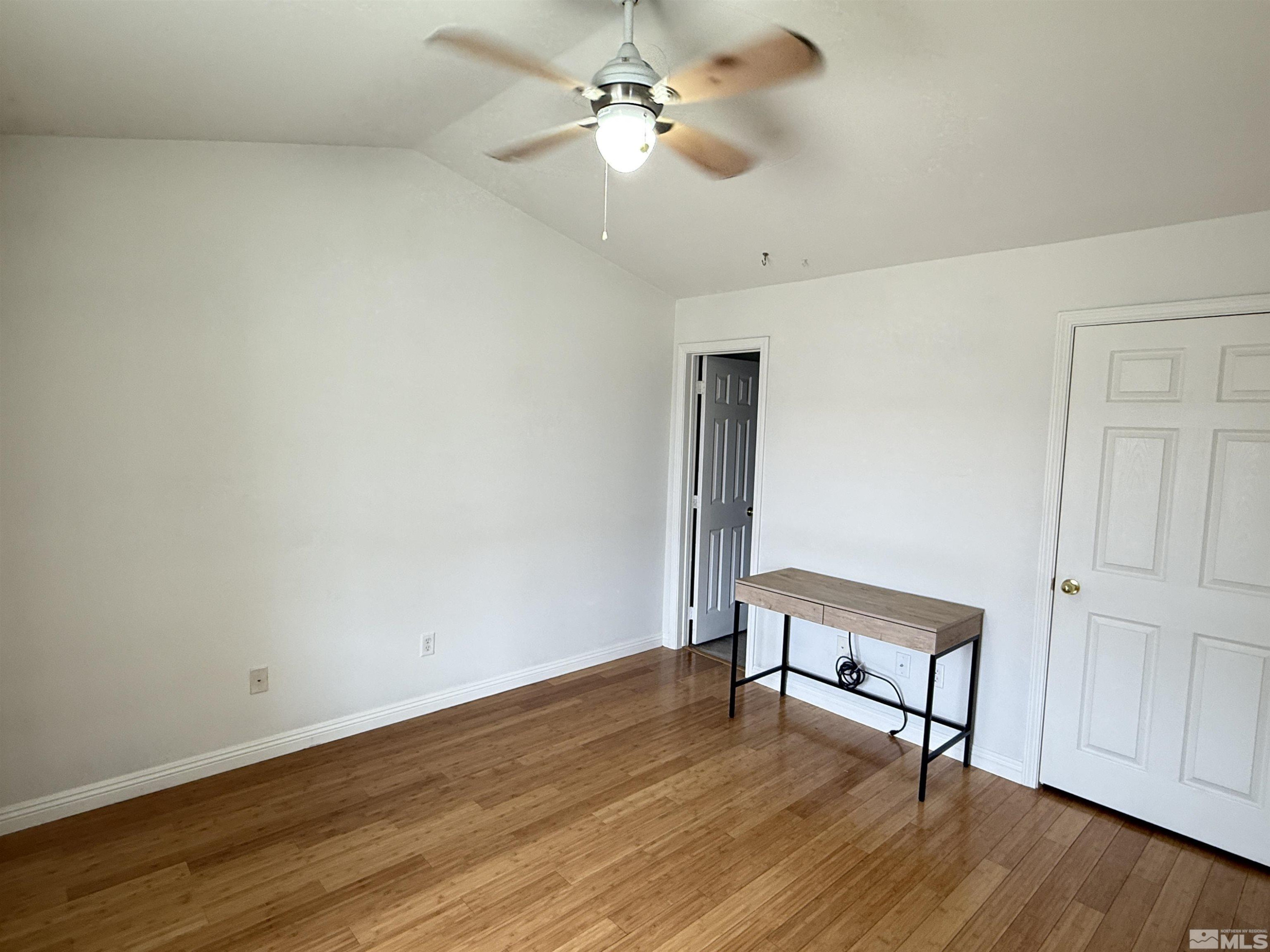 200 Talus Way, Unit 232 Reno, NV 89503 - Photo 11 of 29 a view of room with hardwood floor and ceiling fan
