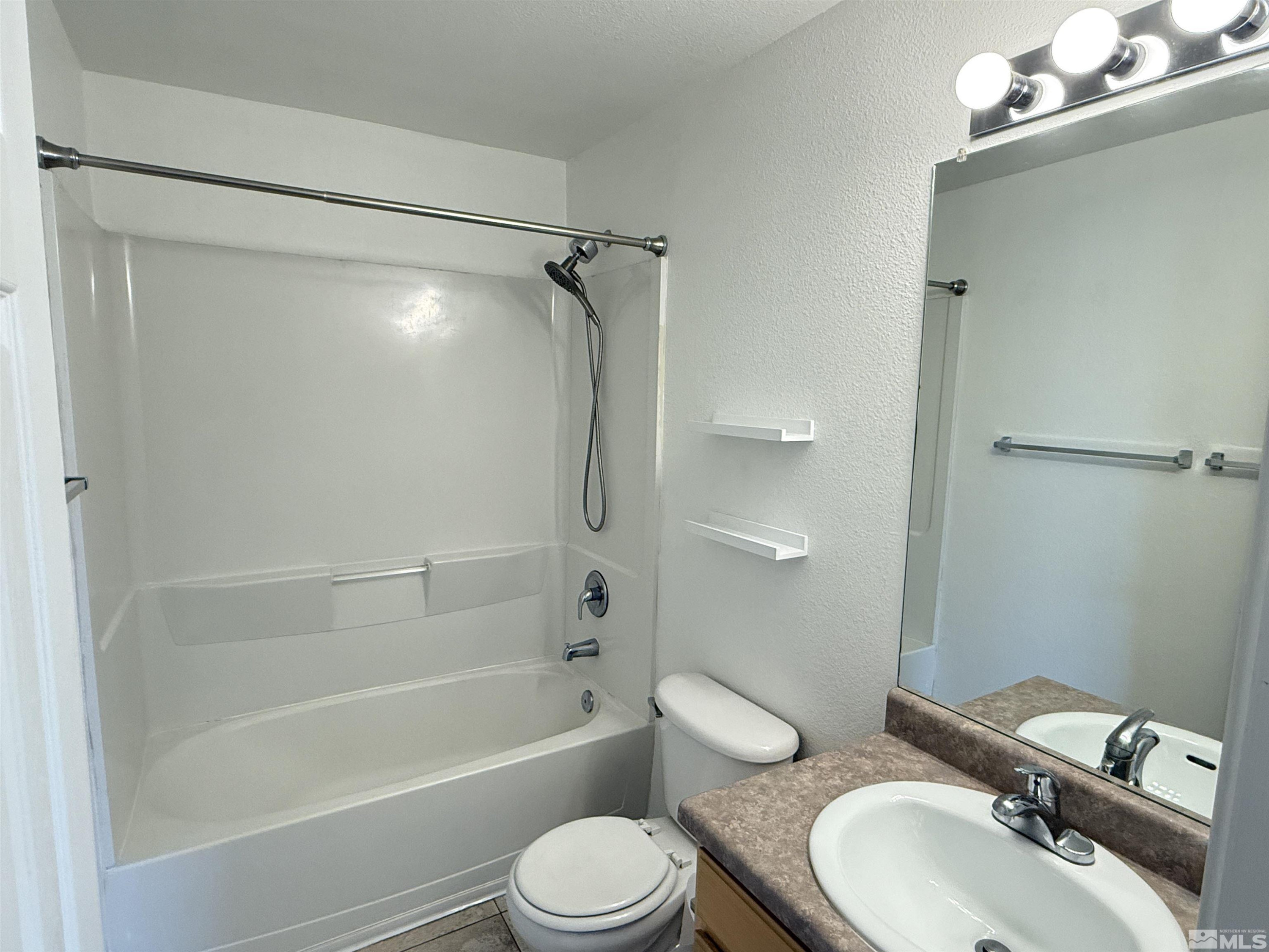 200 Talus Way, Unit 232 Reno, NV 89503 - Photo 14 of 29 a bathroom with a sink toilet and shower