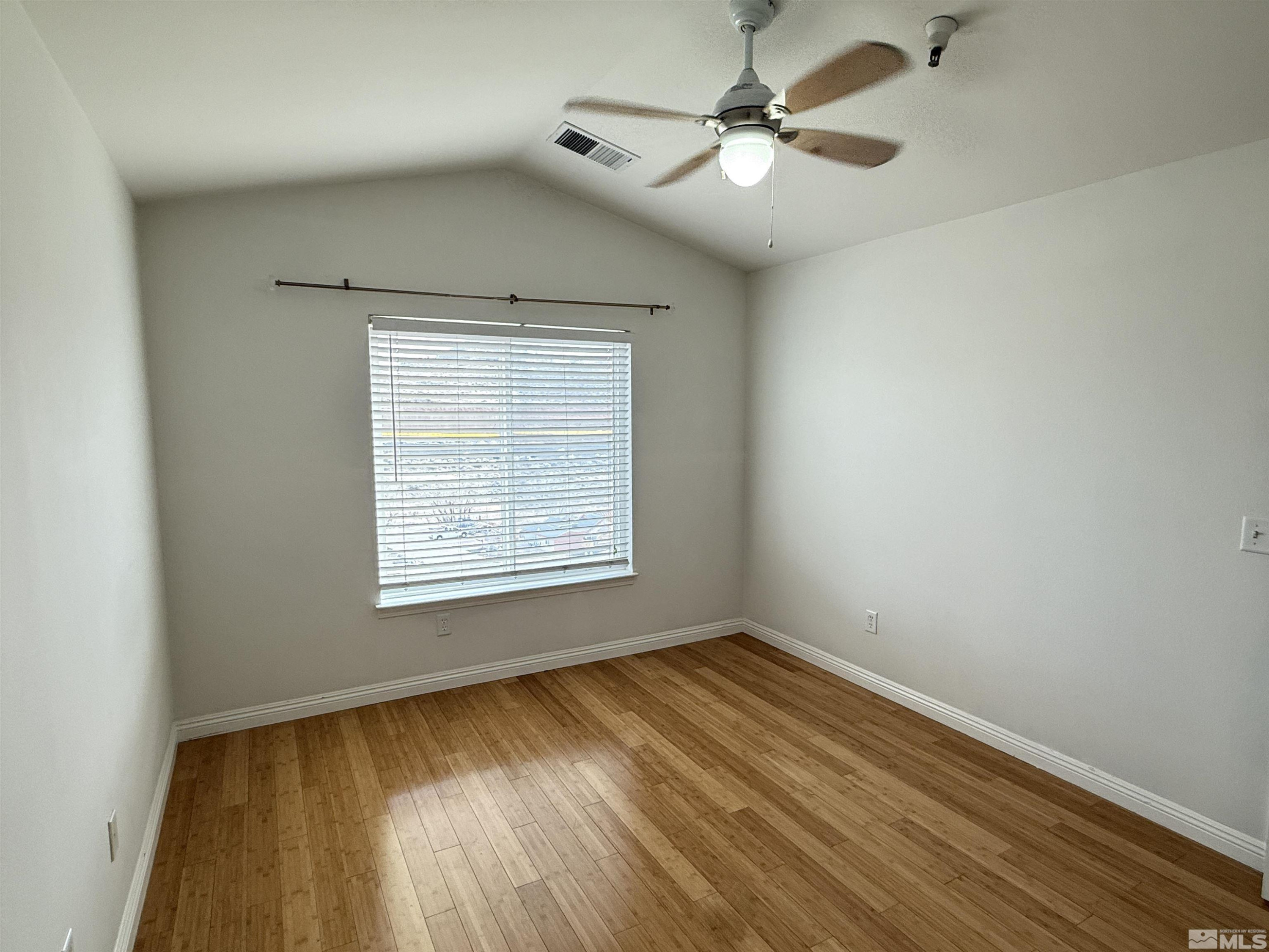 200 Talus Way, Unit 232 Reno, NV 89503 - Photo 18 of 29 wooden floor in an empty room with a window
