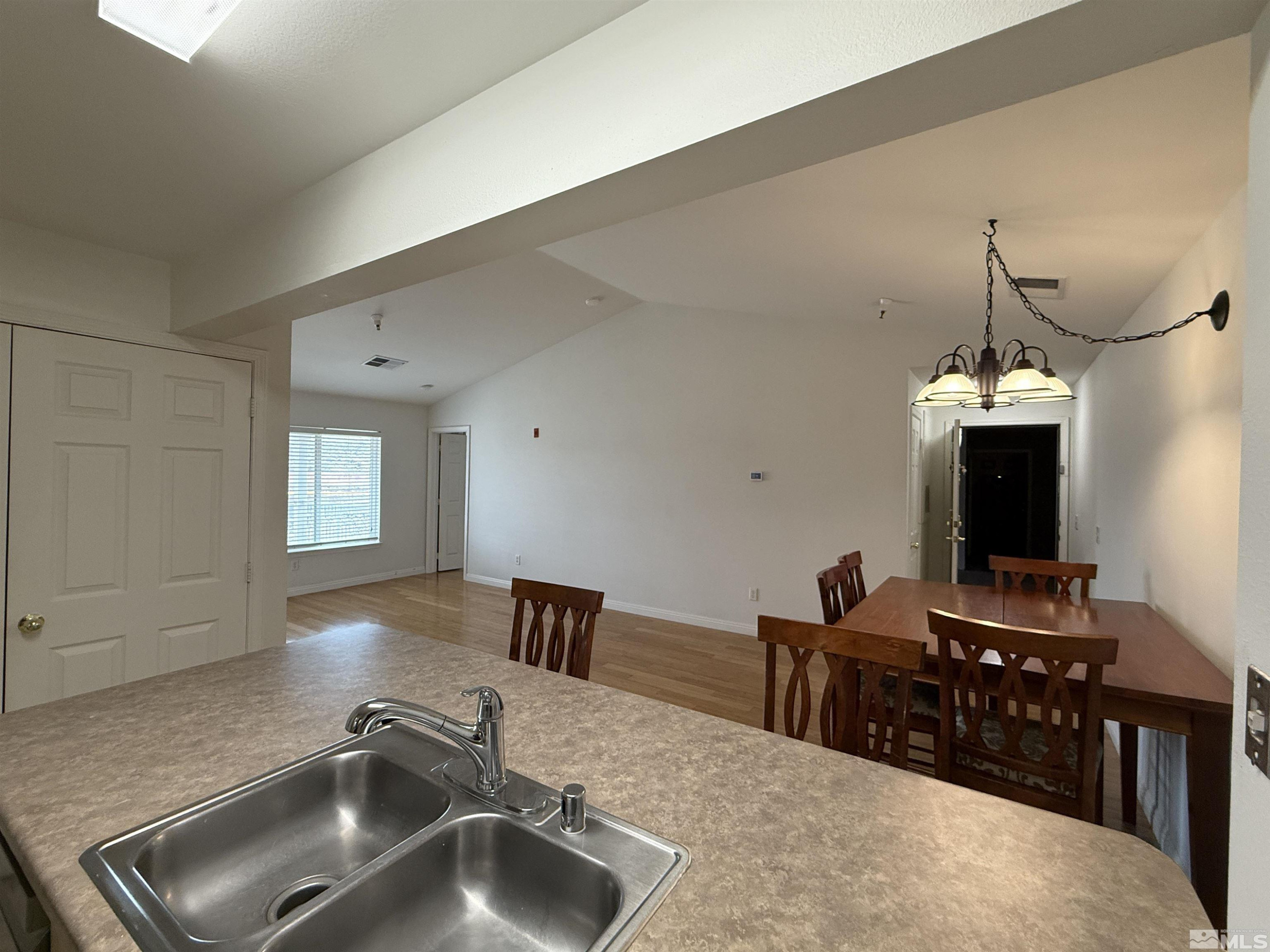 200 Talus Way, Unit 232 Reno, NV 89503 - Photo 3 of 29 a kitchen with a sink and a refrigerator