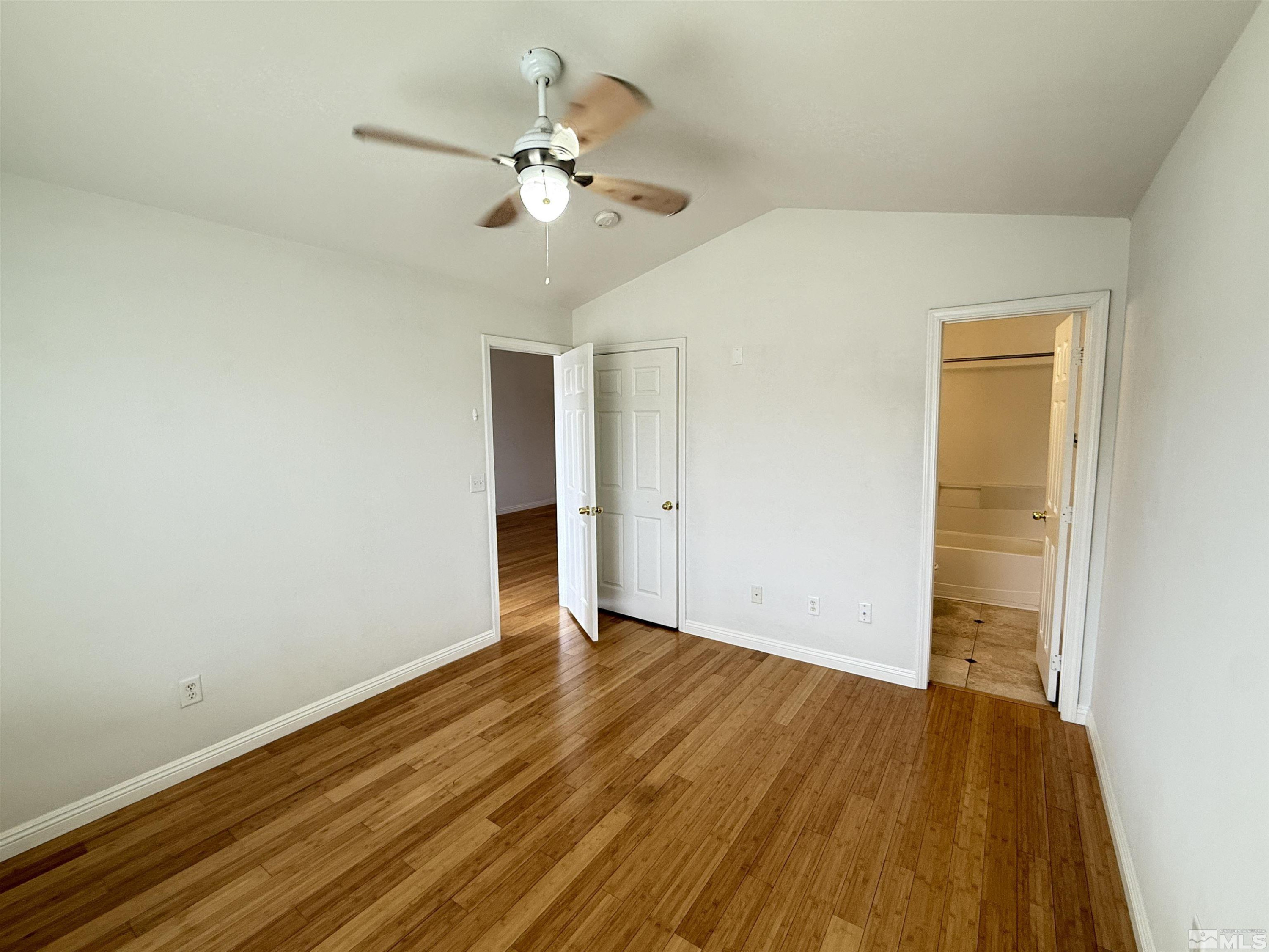200 Talus Way, Unit 232 Reno, NV 89503 - Photo 9 of 29 a view of an empty room with wooden floor