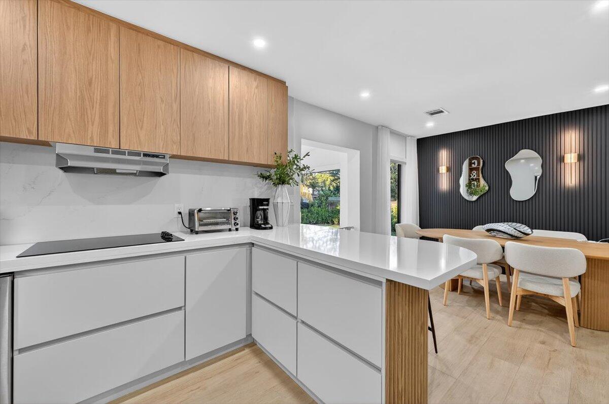 2601 Southwest 26th Lane Miami, FL 33133 - Photo 13 of 34 a kitchen with a sink cabinets and window