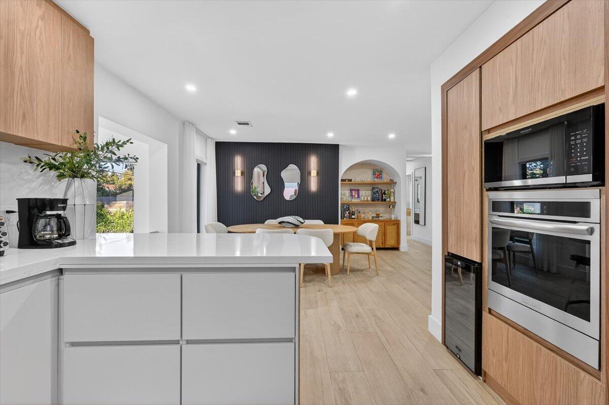2601 Southwest 26th Lane Miami, FL 33133 - Photo 14 of 34 a living room with furniture a fireplace and a flat screen tv