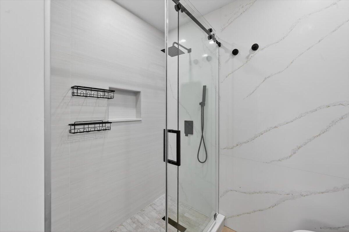 2601 Southwest 26th Lane Miami, FL 33133 - Photo 18 of 34 a bathroom with a shower