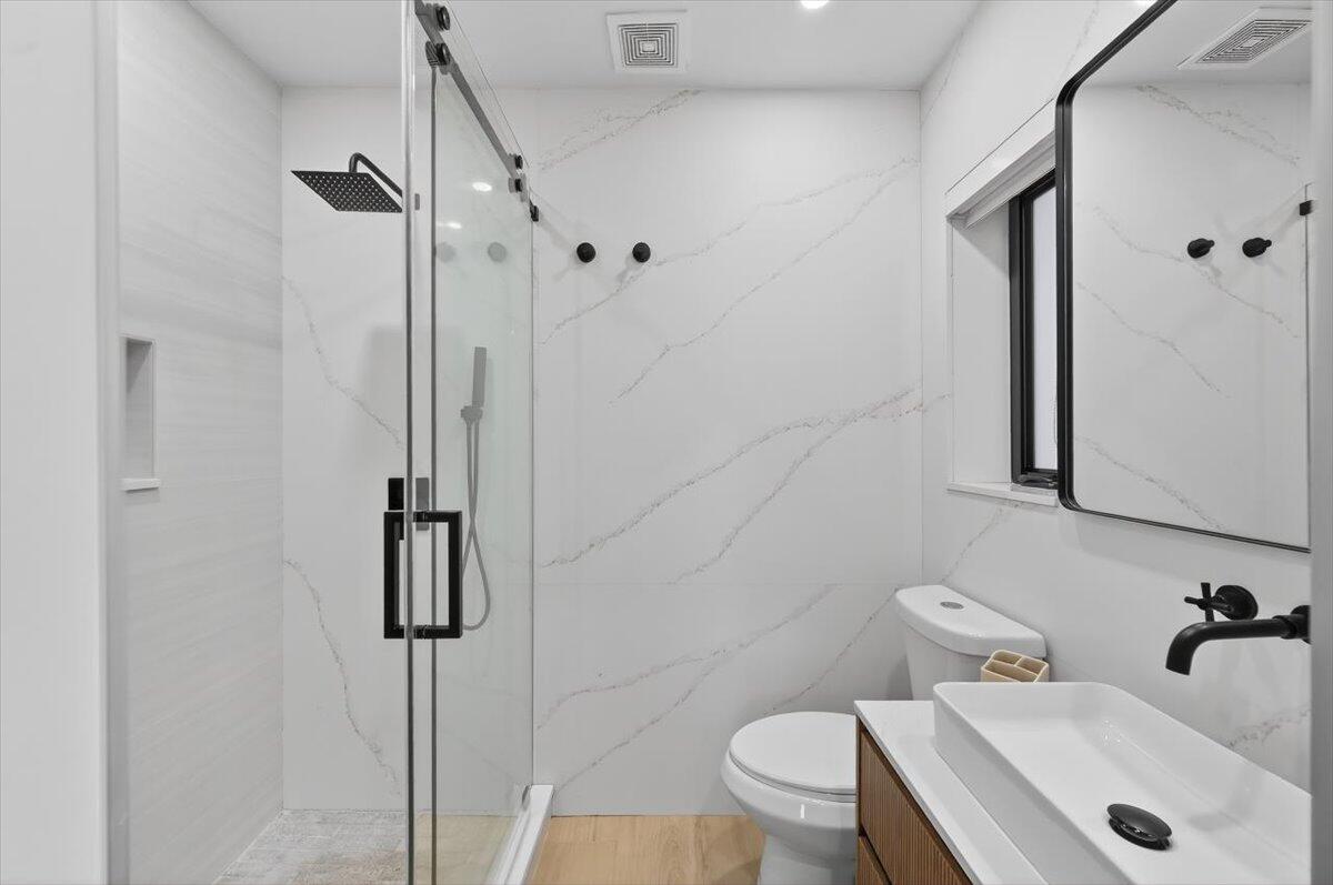 2601 Southwest 26th Lane Miami, FL 33133 - Photo 20 of 34 a bathroom with a sink toilet and shower