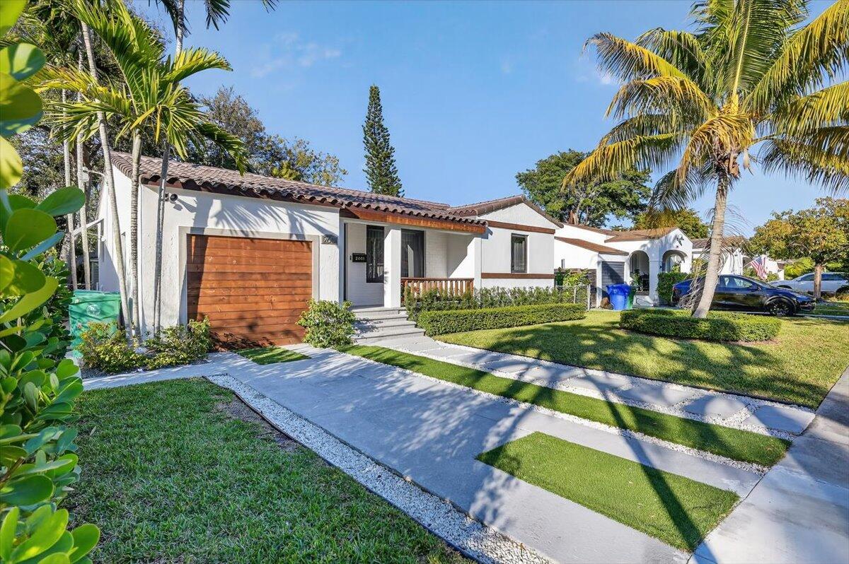 2601 Southwest 26th Lane Miami, FL 33133 - Photo 2 of 34 a view of a house with backyard and sitting area