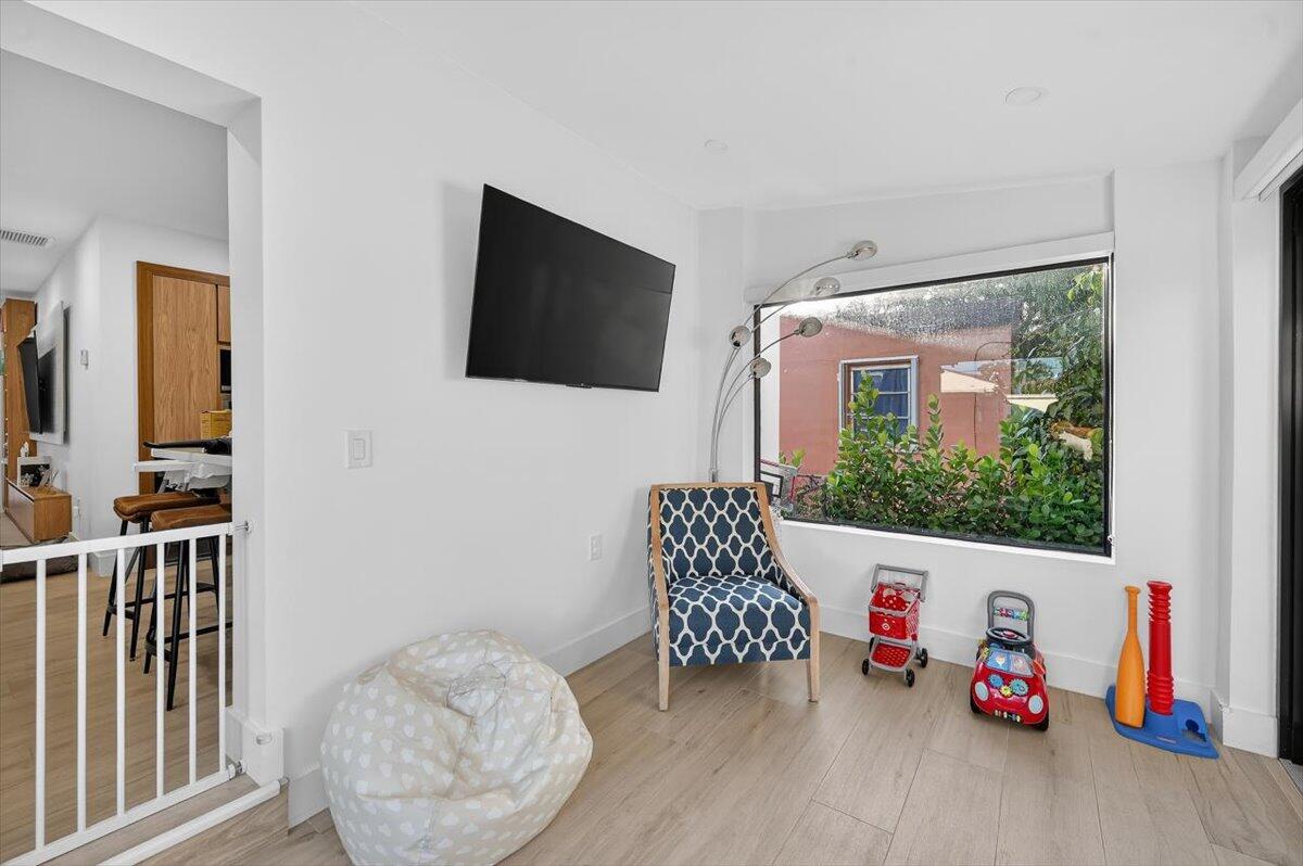 2601 Southwest 26th Lane Miami, FL 33133 - Photo 25 of 34 a room with furniture and a flat screen tv