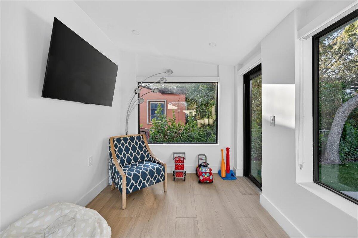 2601 Southwest 26th Lane Miami, FL 33133 - Photo 26 of 34 a living room with furniture and a flat screen tv