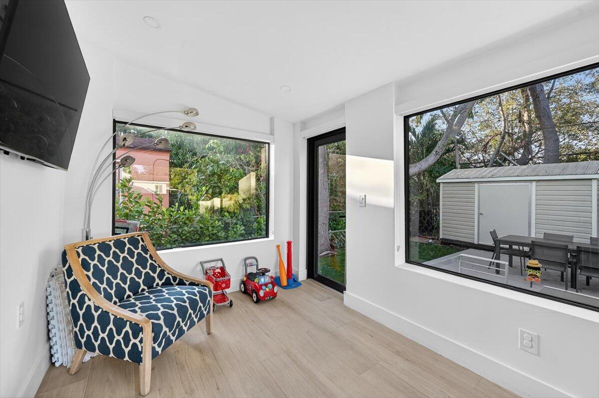 2601 Southwest 26th Lane Miami, FL 33133 - Photo 27 of 34 a living room with furniture and a flat screen tv