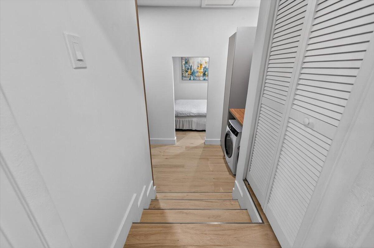 2601 Southwest 26th Lane Miami, FL 33133 - Photo 29 of 34 a view of a hallway with wooden floor and staircase