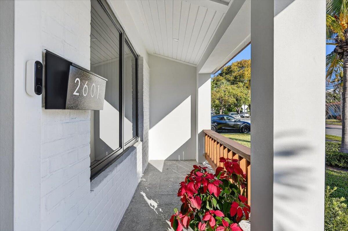 2601 Southwest 26th Lane Miami, FL 33133 - Photo 3 of 34 a view of a hallway with wooden floor and furniture