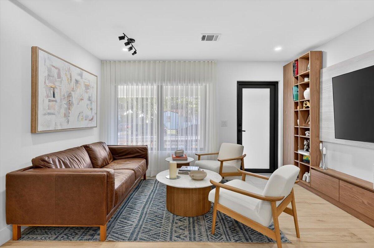 2601 Southwest 26th Lane Miami, FL 33133 - Photo 4 of 34 a living room with furniture and a large window