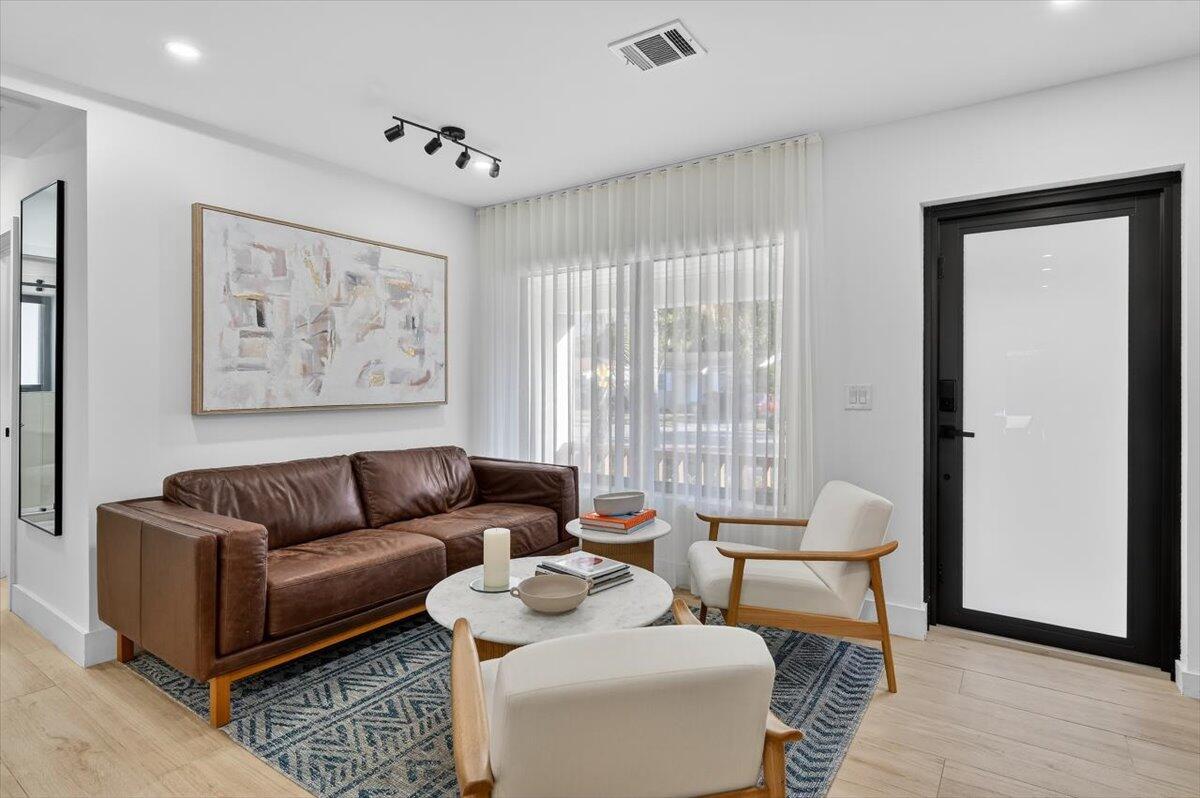 2601 Southwest 26th Lane Miami, FL 33133 - Photo 6 of 34 a living room with furniture and a large window