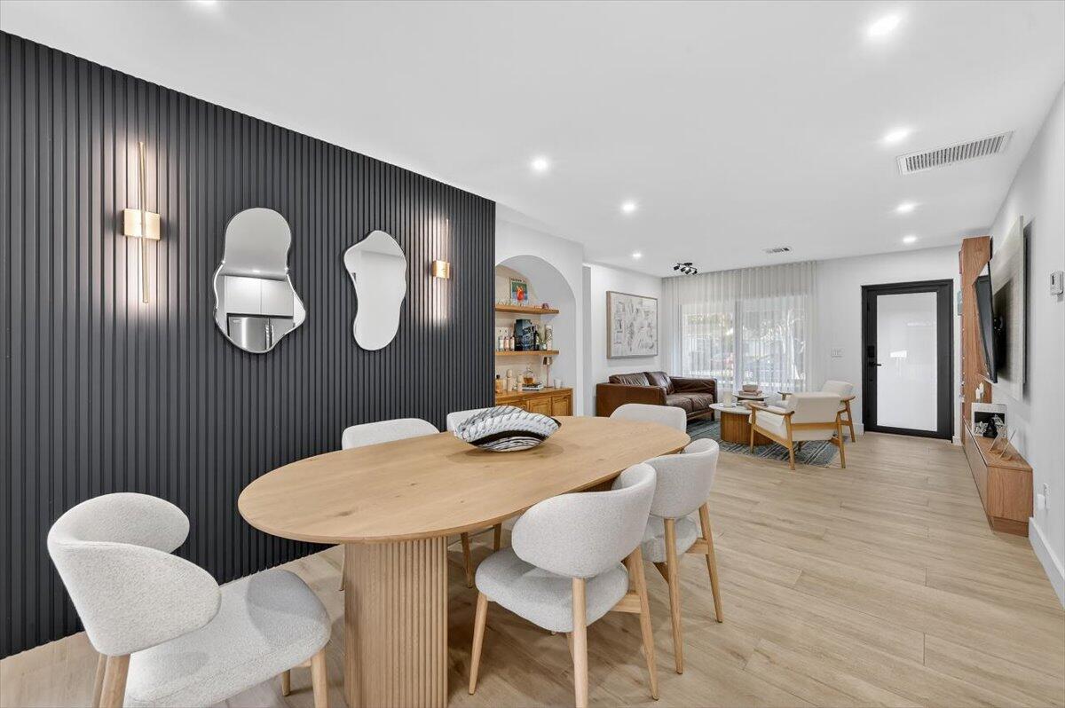 2601 Southwest 26th Lane Miami, FL 33133 - Photo 8 of 34 a dining room with furniture and wooden floor