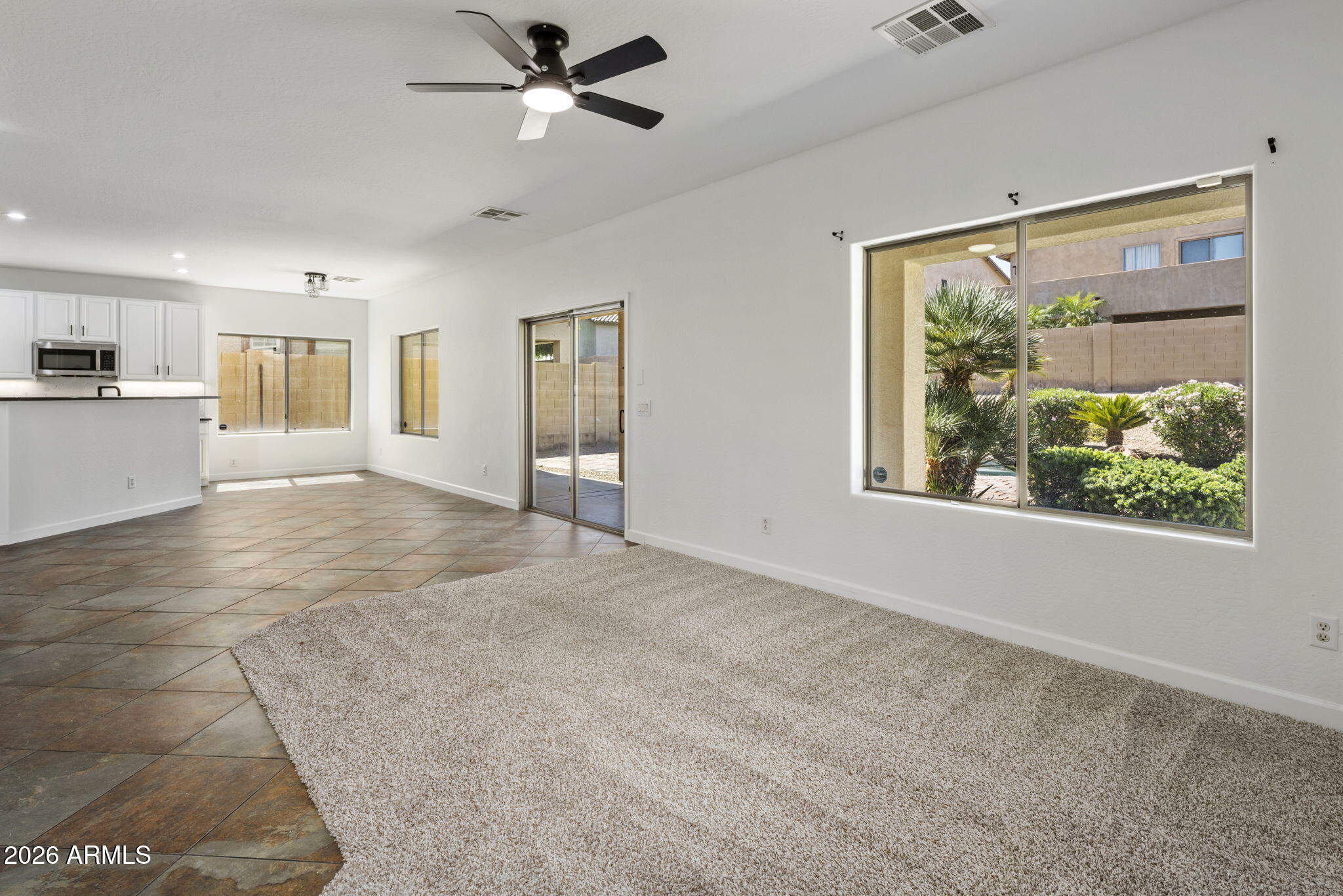 5121 West Beverly Road Laveen, AZ 85339 - Photo 15 of 32 a view of livingroom with hardwood floor and a ceiling fan