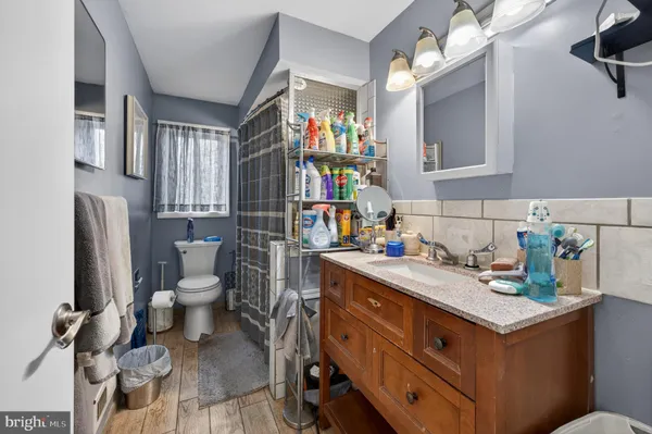 a utility room with sink dryer and washer