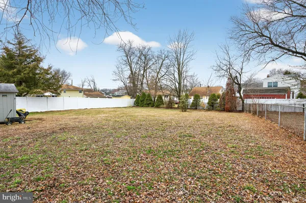 a view of open space with yard